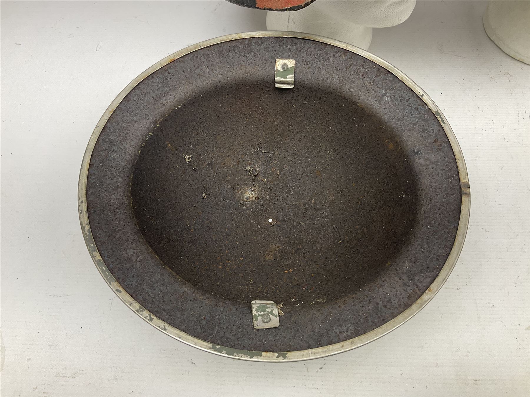 Three battlefield relic helmet shells - WWI German M16; WWI French Adrian; and WWII British (3)