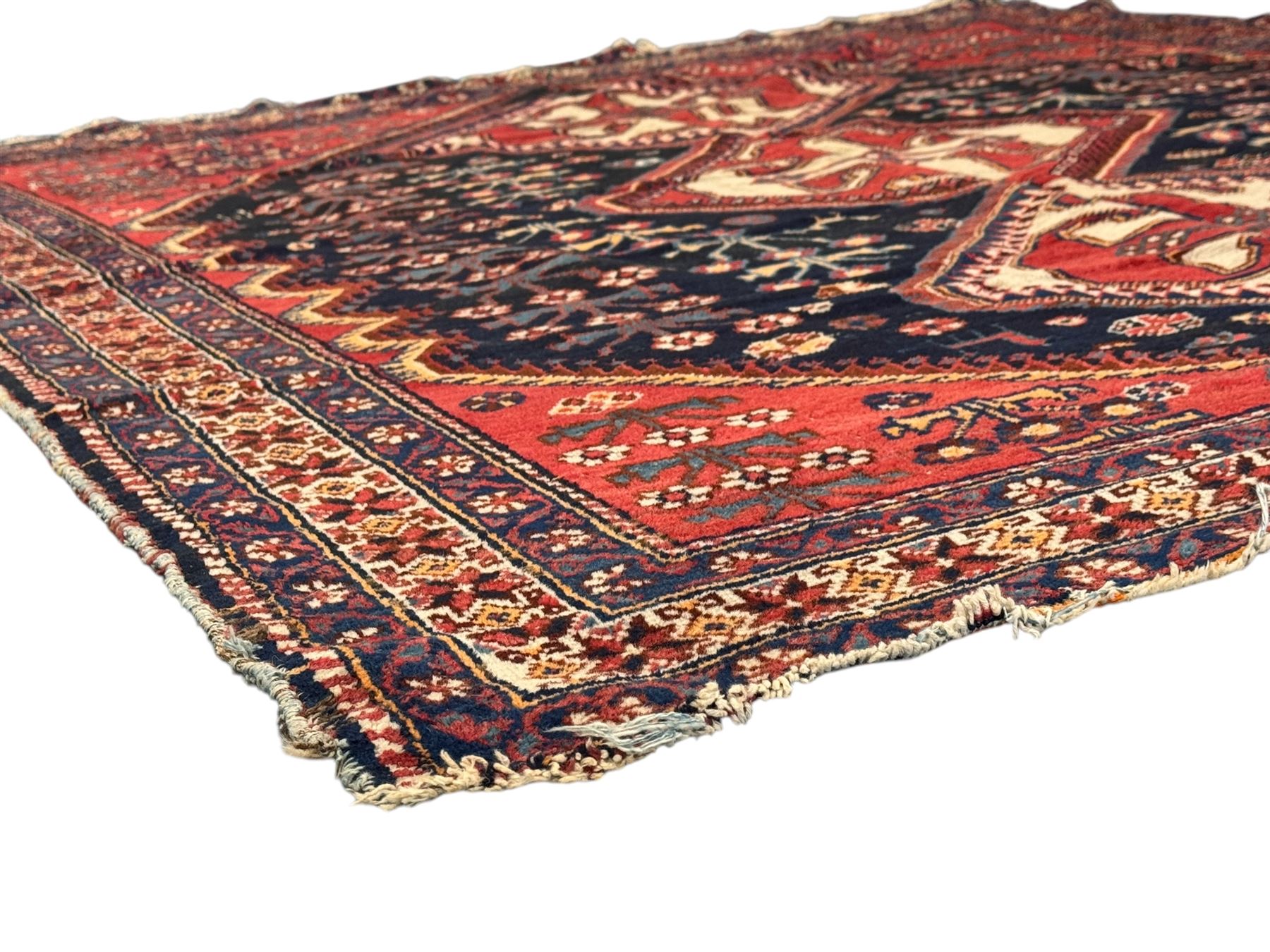 Persian Heriz wool rug, red and ivory field with floral medallion, geometric spandrels, and floral border (157cm x 107cm); Kurdish Shairwan wool rug, red and navy field with three medallions, geometric crosses and serrated border (200cm x 155cm); Persian Qashqai wool rug, golden-yellow field with boteh motifs and wide floral border (127cm x 82cm)