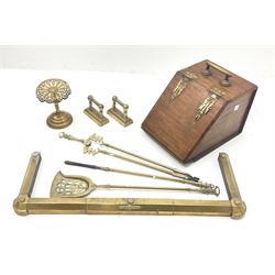 Fireside accessories, comprising mahogany coal box, brass fender, brass companion set, pair of brass tool rests, and brass trivet. 