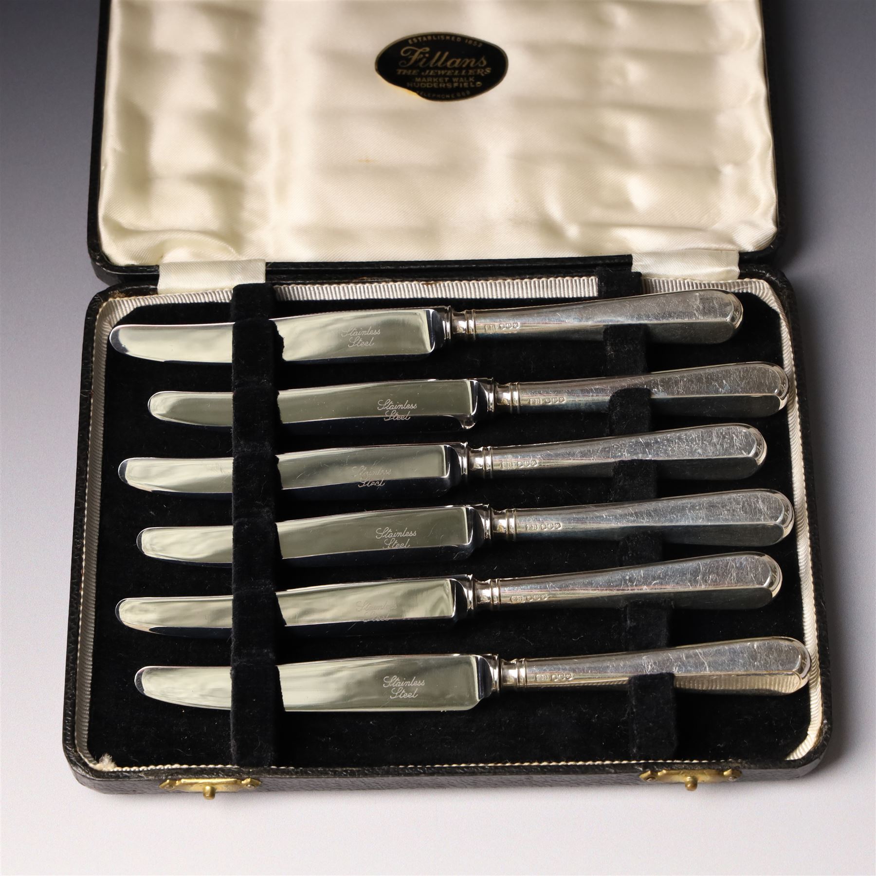 Set of six silver coffee spoons Birmingham 1933 , another set with bright cut stems and set of six silver handled pastry knives, all cased