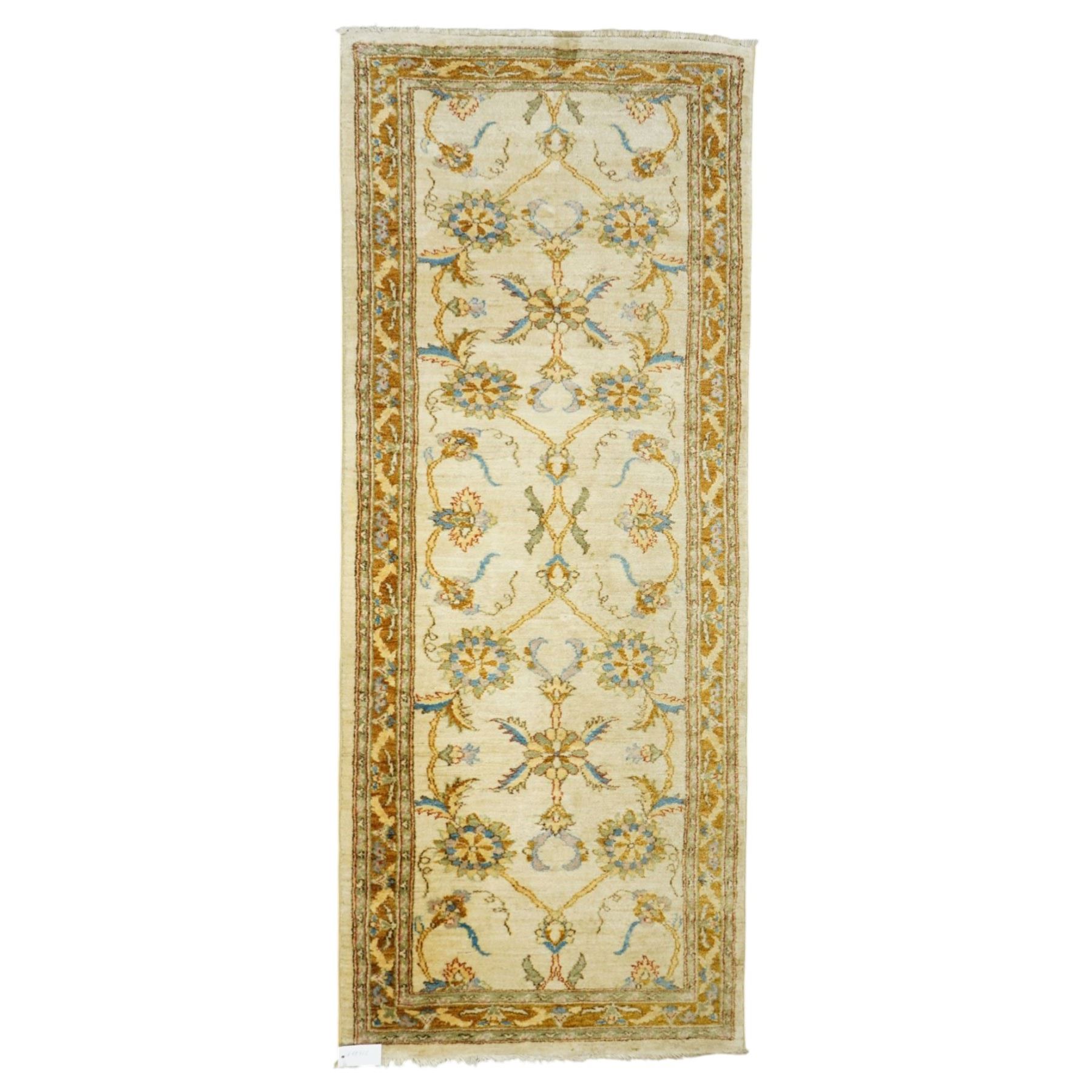 Modern Pakistani Oushak style hand-knotted runner,  ivory field with an all-over scrolling floral vine design incorporating stylized palmettes and rosettes in soft tones of pale blue, sage green and muted gold, enclosed by conforming border, cotton fringe ends 