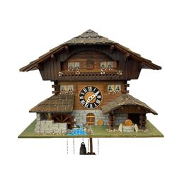 An automaton musical cuckoo clock with a 20th century three weight movement in the form of a Swiss Chalet with a working waterwheel, traditional dial and hands, thirty-hour movement with a cuckoo sounding the hours and half hours on twin bellows, hours followed by one of three tunes played on a musical box and the revolving of the water wheel. With pendulum and weights.




