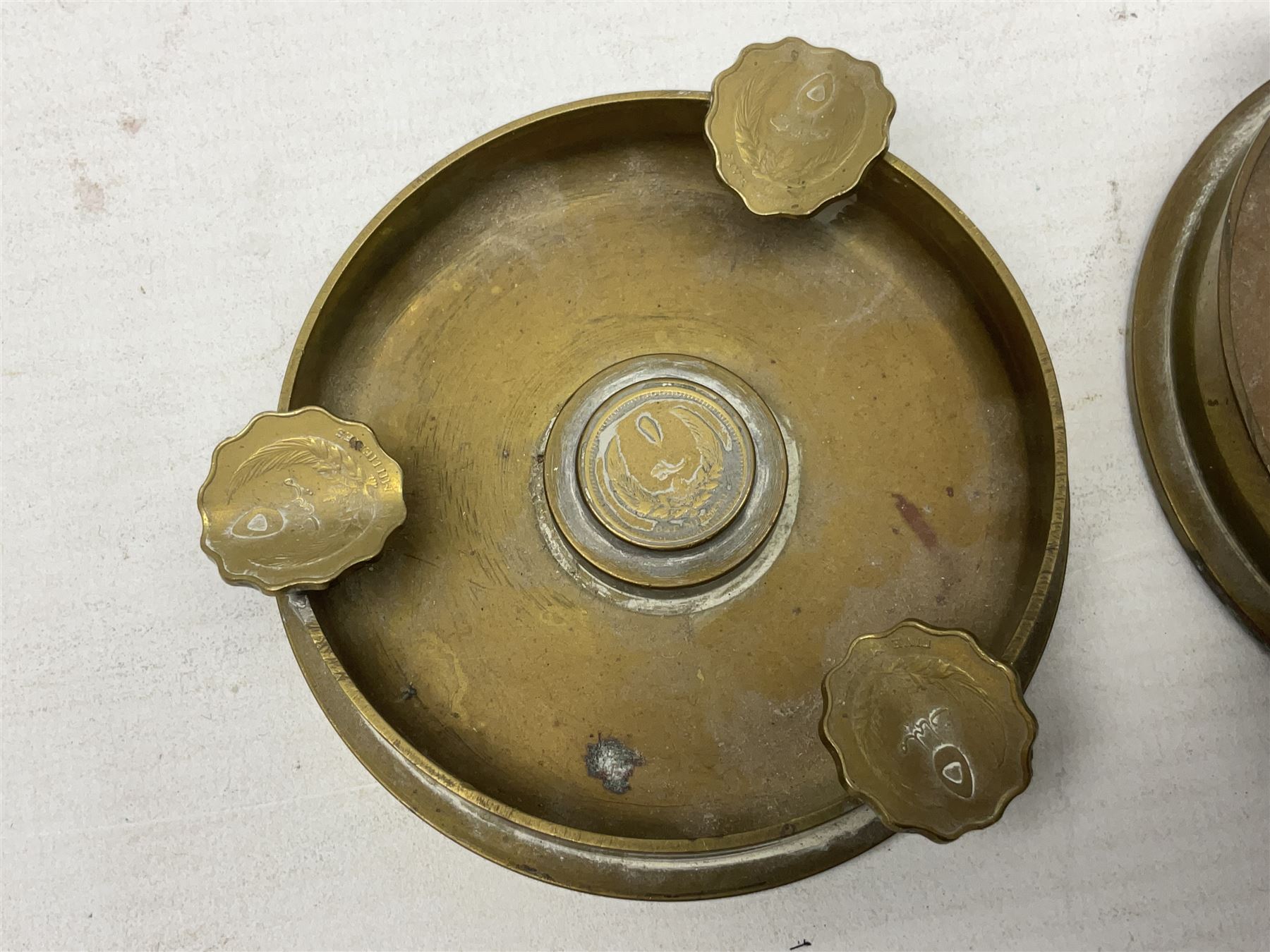 Four post-WW2 'silver' medallions of Adolf Hitler/German interest, two depicting Von Hindenburg also; and pair of 1960s trench art shell case bases as ashtrays mounted with Libyan Five Milliemes coins as cigarette rests (6)