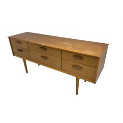 Austinsuite - Mid-20th century teak sideboard, fitted with six drawers, raised on tapered supports