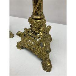 Pair of gilt metal pricket candlesticks, with applied decoration on knopt stems and triform bases, H47cm
