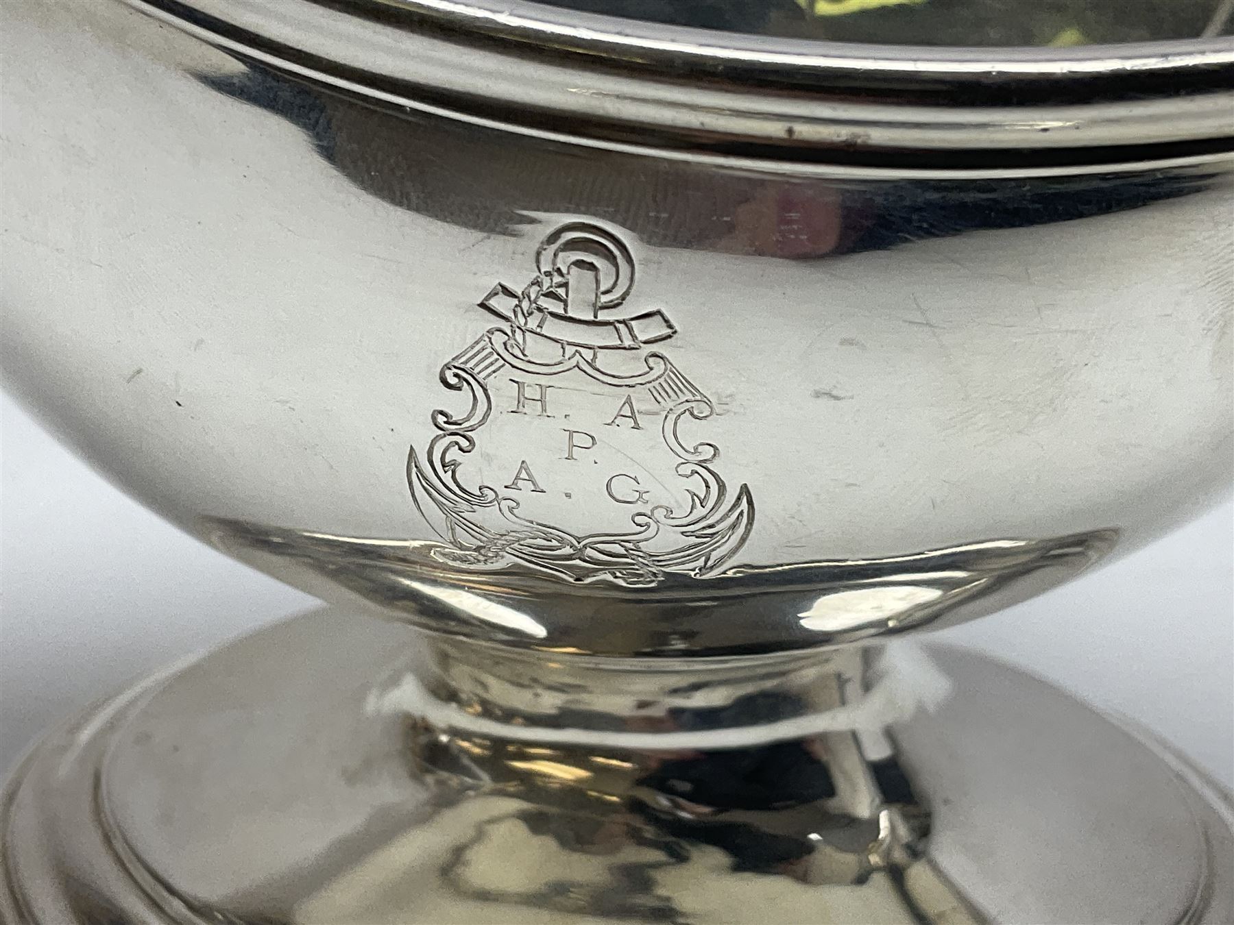Christofle silver-plated sauce boat, of typical plain form, with capped C scroll handle and engraved anchor crest to body, upon a stepped oval foot, stamped 22 Christofle to base, including handle H14cm