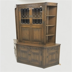 Old Charm - oak three sectional cocktail display cabinet, two lead glazed doors above fall front enclosing fitted interior, two drawers above two cupboard doors, flanked by six open shelves and two cupboards