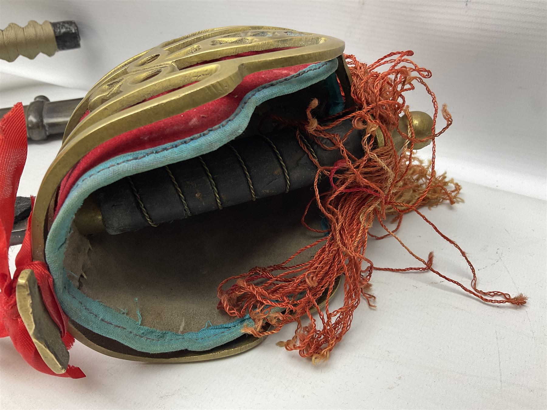 Reproduction Scottish officers basket hilt broad sword, the brass basket pierced with heart-shaped motifs lined with red lining, together with a reproduction Japanese Katana sword, longest L110cm