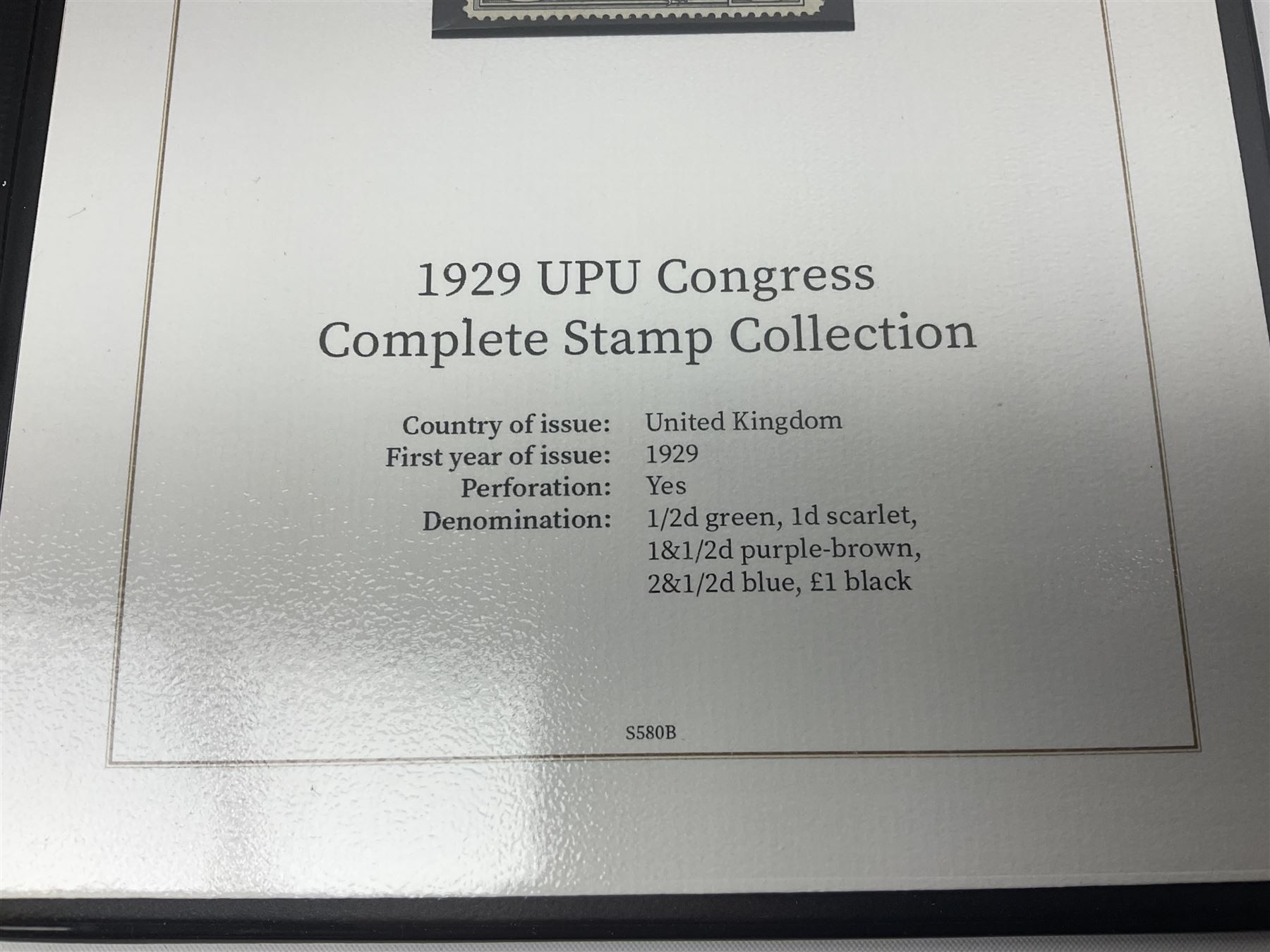 Great Britain King George V 1929 Postal Union Congress one pound stamp, halfpenny green, penny scarlet, one and a half pence purple-brown and two and a half pence blue, all unused, housed in a Harrington and Byrne folder