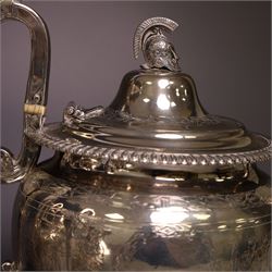 Early 20th century four piece silver tea service, comprising teapot, hot water pot, open sucrier and milk jug, all of oval bellied form with oblique gadrooned rim and upon four feet, the hotwater and teapot with wooden handles and finials, hallmarked William Lister & Sons, Sheffield 1912