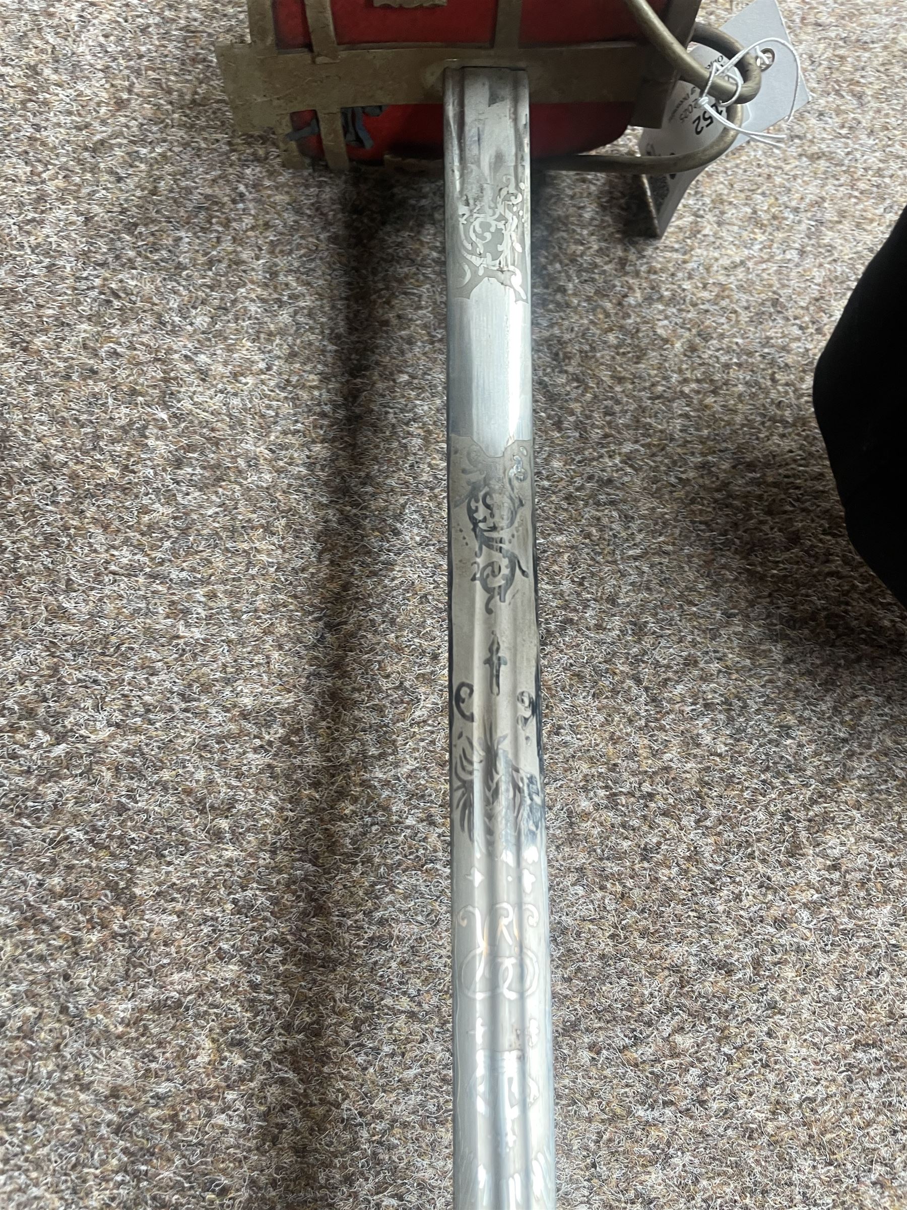 George V basket hilted broad sword with engraved blade, wire wound fish skin grip and field service scabbard, blade length 83cm