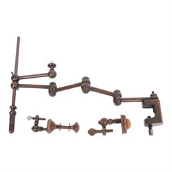 Three 19th century sewing clamps, comprising large example with five articulated arms and ...
