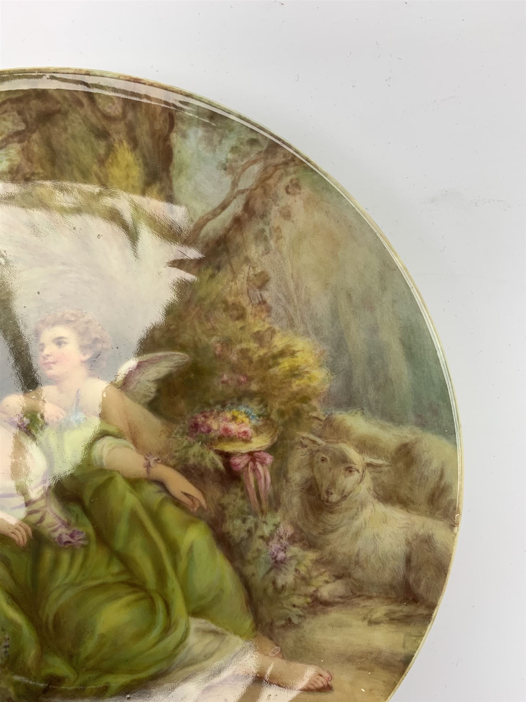 Late 19th century porcelain plate, hand painted by Frederick Sutton, depicting a female figure and putto within a wooded landscape, with recumbent sheep and brook to the fore, signed F N Sutton, unmarked verso, D22.5cm

Frederick Sutton was employed as a painter at the notable factories of Royal Worcester, Coalport, and Minton. 