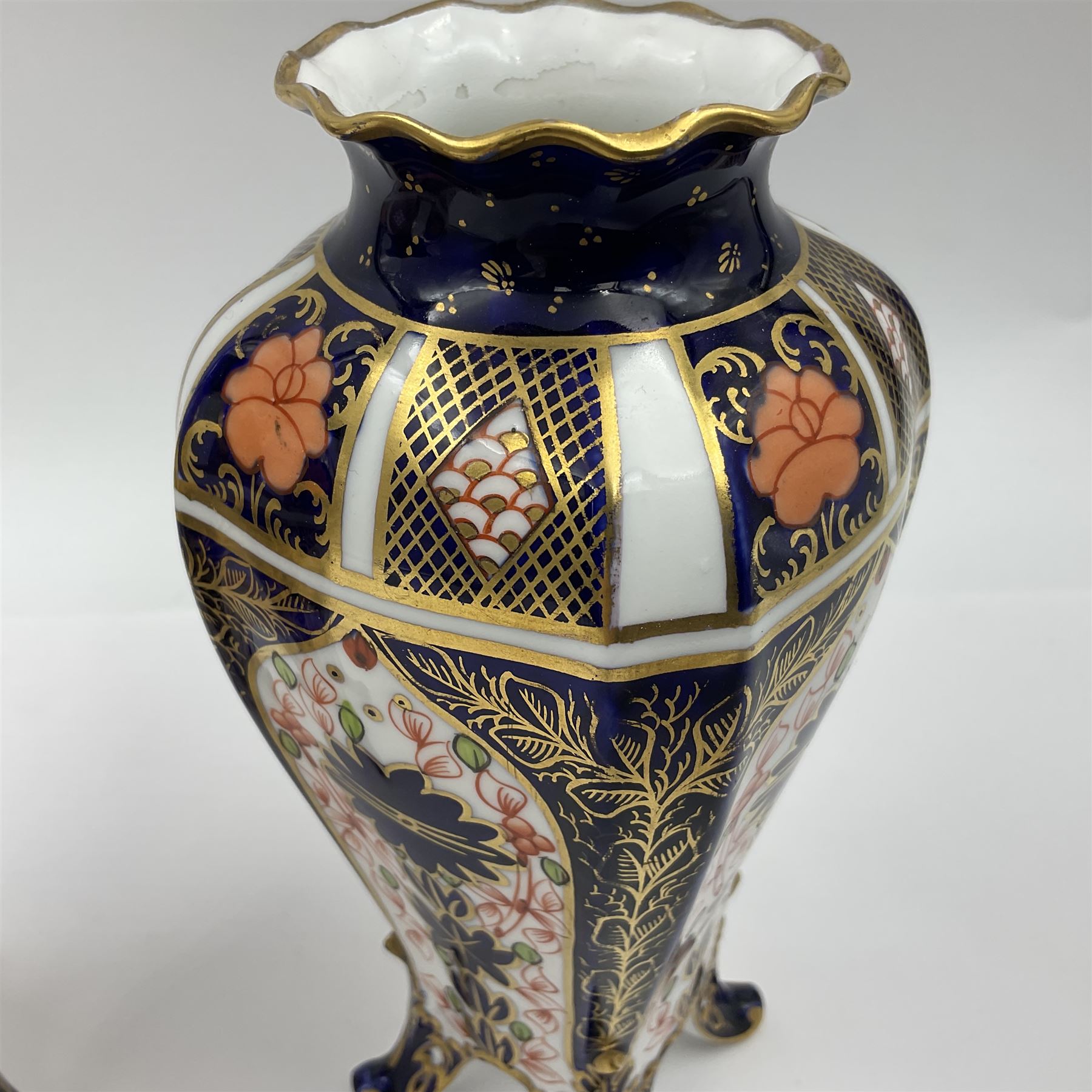 Pair of early 20th century Royal Crown Derby Imari 1128 pattern vases, of tapering straight sided form with waisted neck and frilled rim, upon four splayed feet, with printed and painted marks beneath including illustration date codes for 1911 and 1920, H17cm