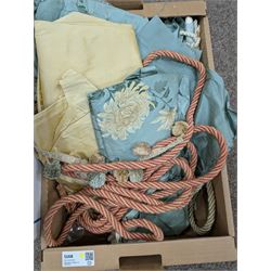 Collection of curtain fabric pieces and tassels