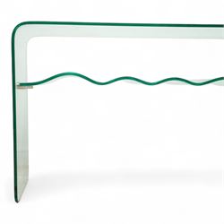 Contemporary glass two-tier console table of minimalist design, rectangular top with a single sheet of curved glass with a waved under tier supported with metal fittings 