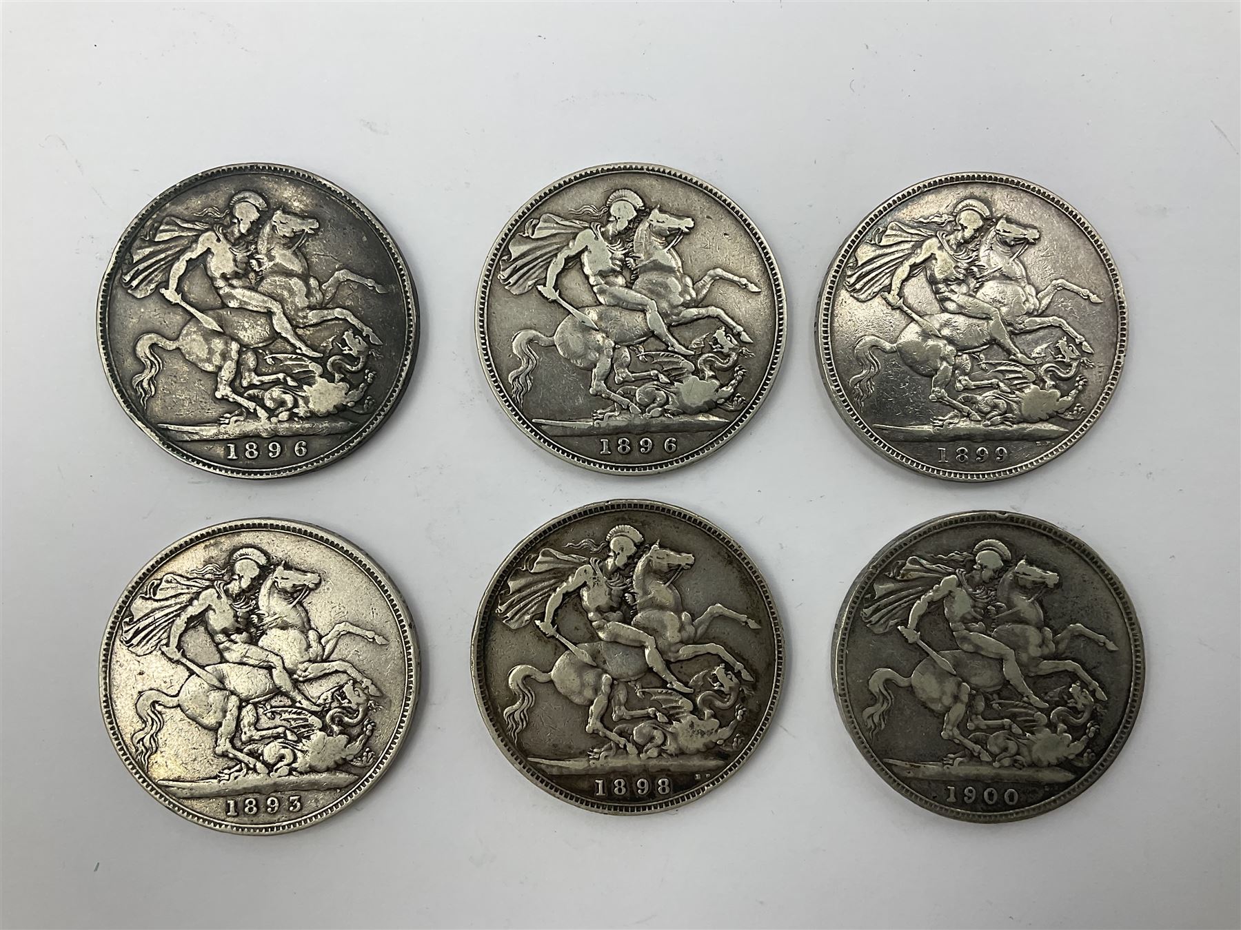Six Queen Victoria silver crown coins, dated 1893, two 1896, 1898, 1899 and 1900