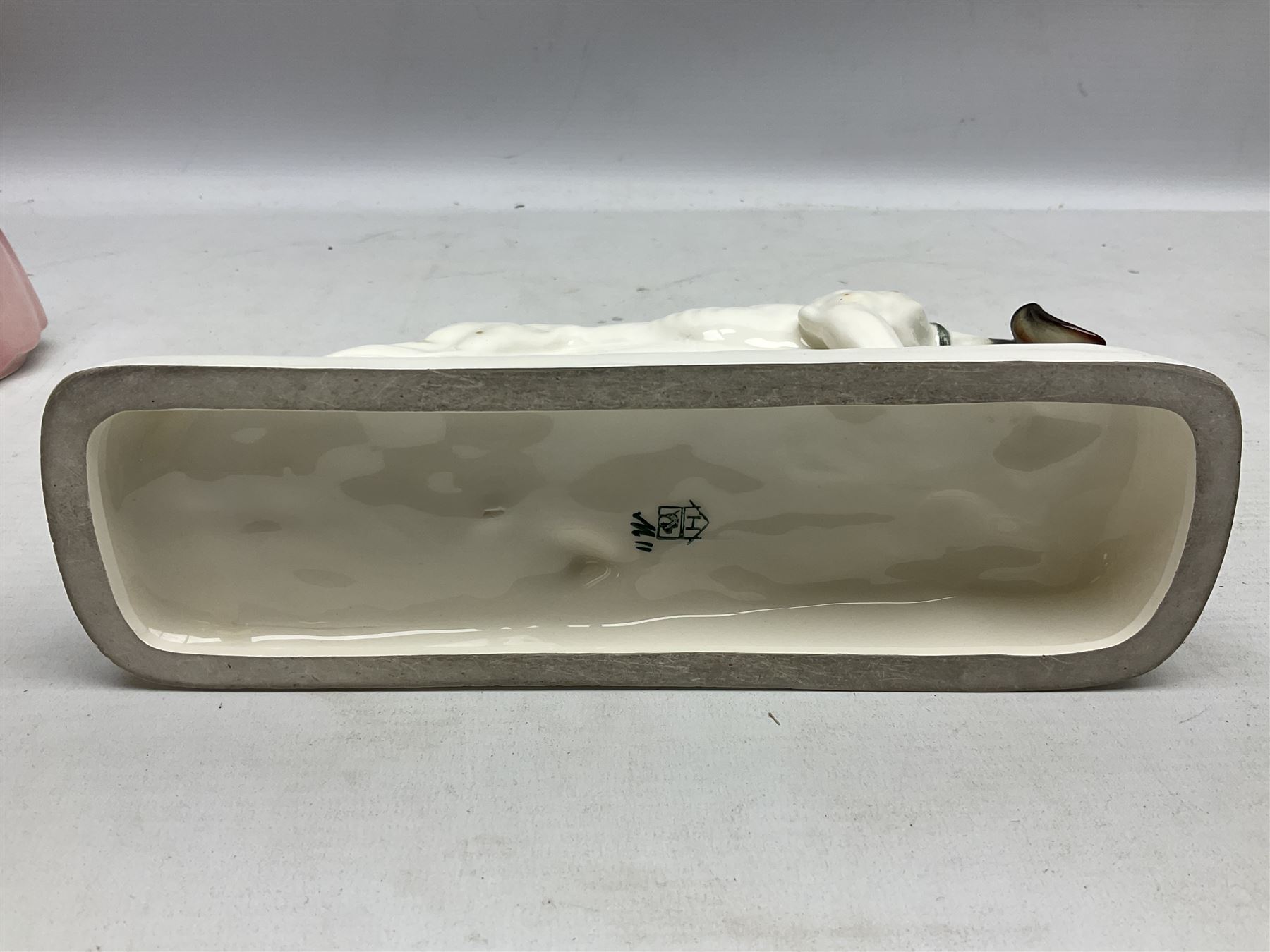 Early 20th century Katzhütte figure of a pointer dog, and figure of a young girl holding basket and fan, both with green cat H house printed mark beneath, dog L25cm