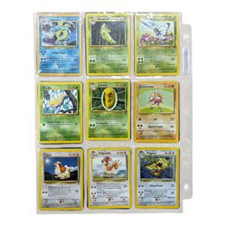 Collection of mainly vintage Pokemon cards including Charizard Base Set Holographic number 4/102 and two Ancient Mew 2000 promo cards, some housed within plastic wallets and some loose