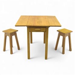 Late 20th century pine kitchen table and two stools, the rectangular drop-leaf table with ...