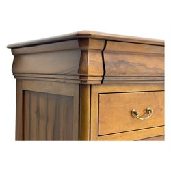 French cherry wood kneehole desk or dressing table, moulded rectangular top over twin pedestal bases each housing three drawers with brass-effect swing handles, resting on bracket feet
