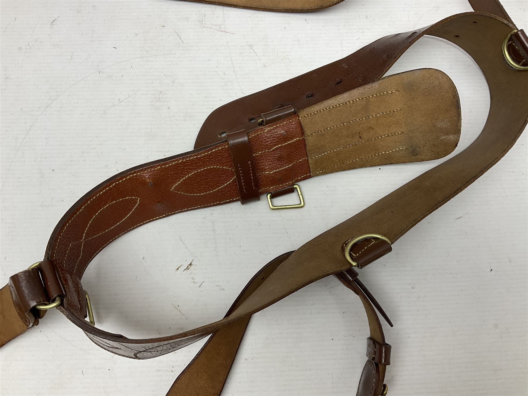 British Army General Staff officer's peaked cap by Herbert Johnson London in Moss Bros. delivery box; two officer's Sam Browne leather belts; leather pistol holster and sword hanger; pair of leather gloves and pair of spurs