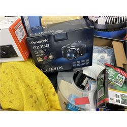 Large quantity of camera equipment in three boxes - Lumix GX1 camera, Canon EOS 500 camera, Lumix FZ100 camera, Pantax  MZ5n, various other cameras, Swift spotting Scope 20 x 60 in box,  Maxtor hard drive, three tripods, Kodak carousel projector, Pradolux slide projector, a selection of camera bags and other camera equipment. 