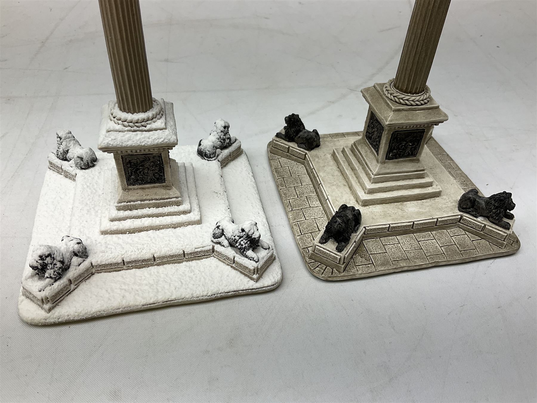 Five Lilliput Lane models from the 'Britain's Heritage' collection, comprising The Royal Albert Hall, Windsor Castle Round Tower, Eros and Nelson's Column and another snowed, all boxed