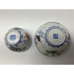 Two Chinese eggshell porcelain bowls, polychrome decorated with birds in branches, floral sprays and swimming fish, each with surrounding blue ruyi border decoration and character marks beneath, D12cm
