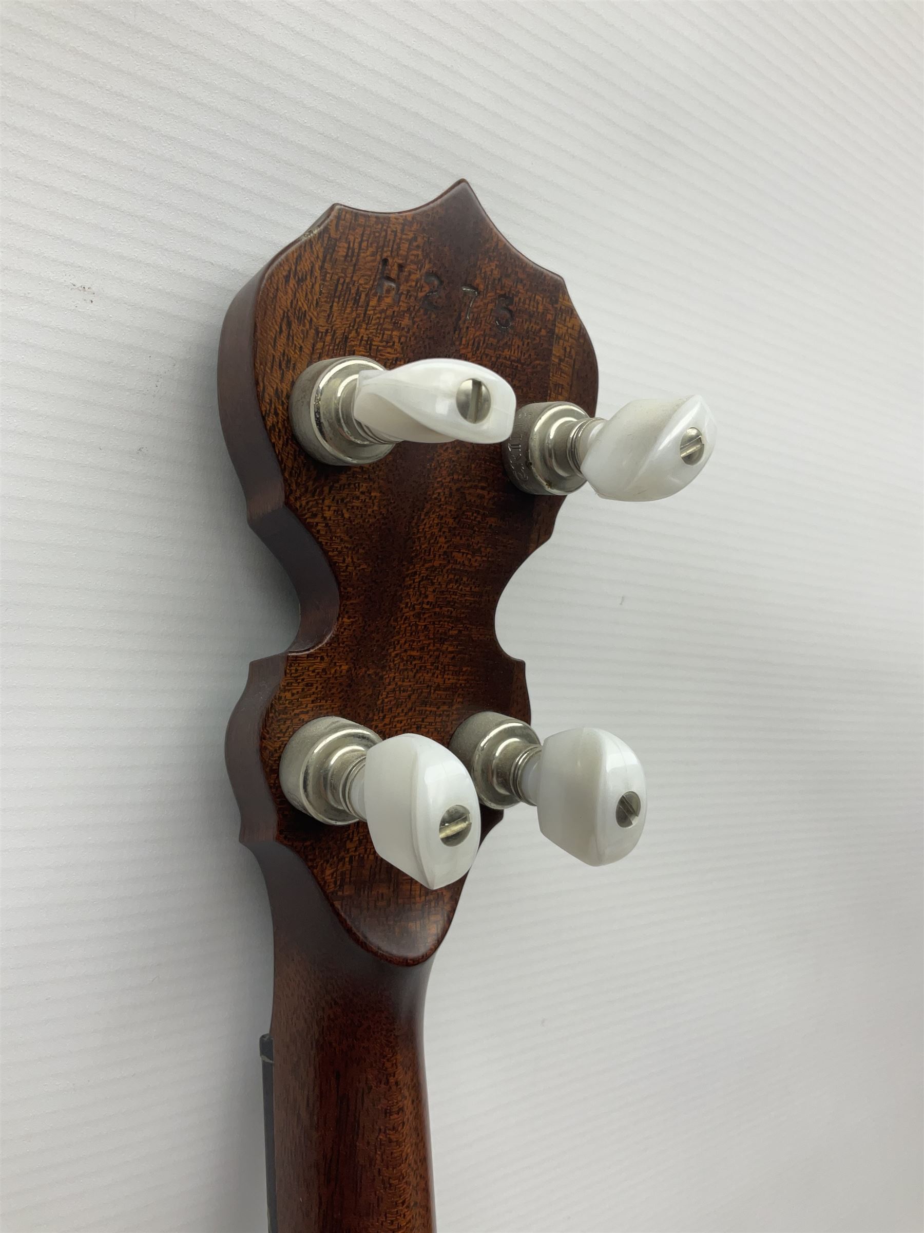 Deering seventeen-fret tenor banjo with cast metal body, serial no.H275, L79cm overall; in fitted hard carrying case