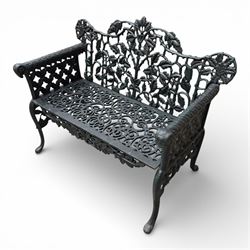 Coalbrookdale style - cast iron garden bench, with pierced foliate back, rams head arms, raised on cabriole legs, finished in green paint.