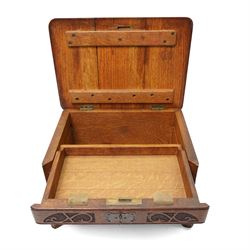 Arts & Crafts Design oak sewing box carved with initials and dated 1907, with sliding top, lion mask ring handles on shaped supports. W36cm