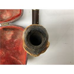 Carved meerschaum and amber pipe with silver mount, the bowl carved as a woman, cased, clay pipe in the form of an acorn, ceramic pipe, five other pipes and a ceramic bottle pourer in the form of a horse  