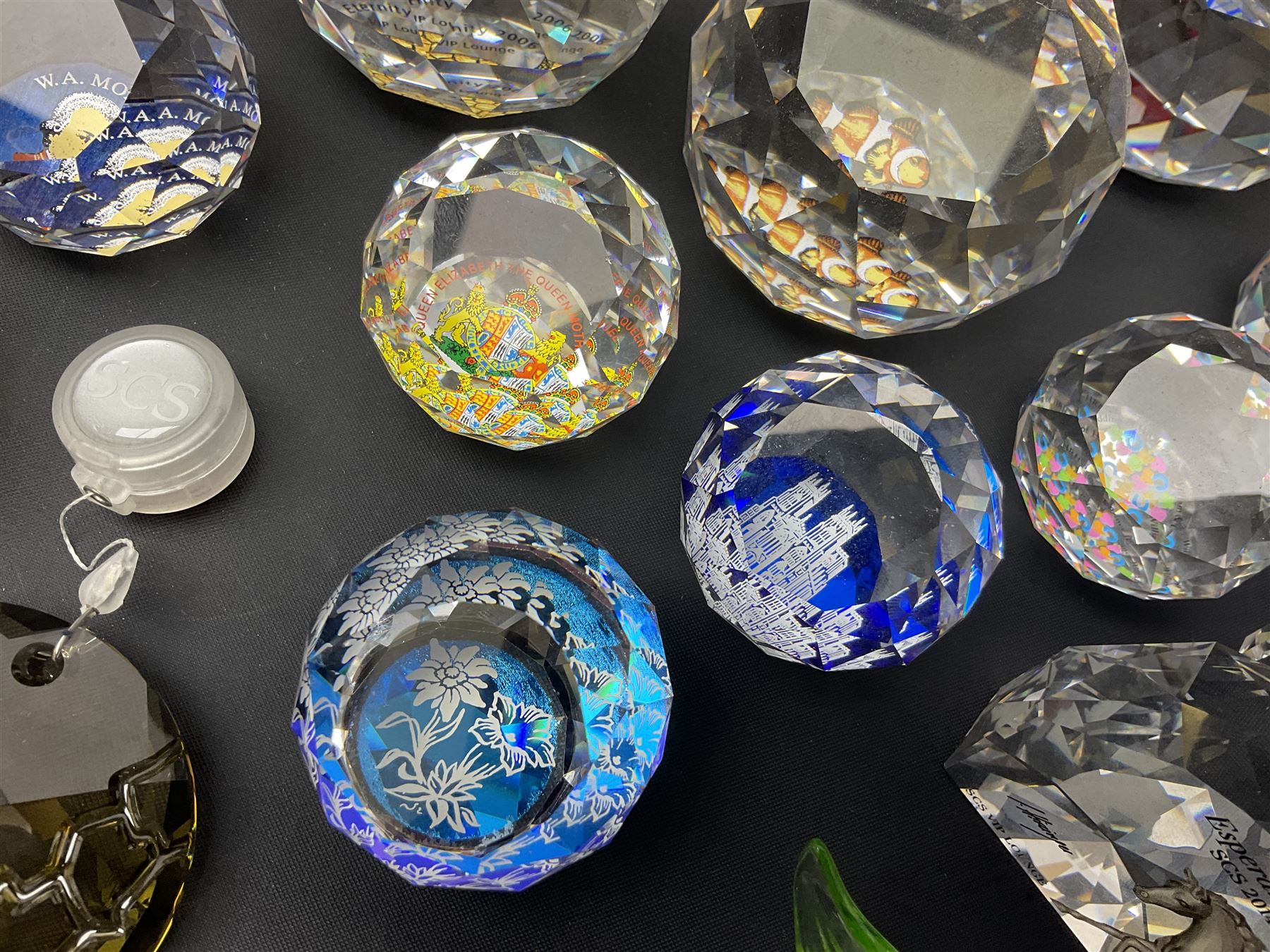 Swarovski Crystal paperweights, to include a globe with dove to the top, pyramid shapes etc, together with a large collection of boxes and stands  