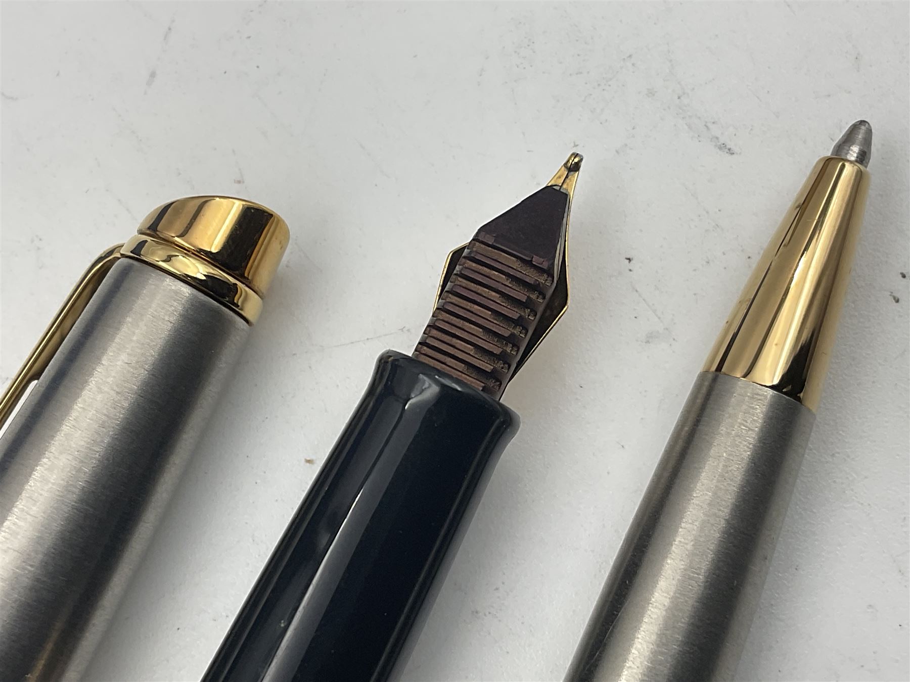 Group of Waterman pens and propelling pencils, to include a fountain pen, the black barrel with rolled gold cap and nib stamped 14ct, together with a matching propelling pencil, in box, together with a further fountain pen with gold nib stamped 14ct, stainless steel fountain pen and rollerball set in box, propelling pencil with maroon barrel etc, largest L13cm (7)