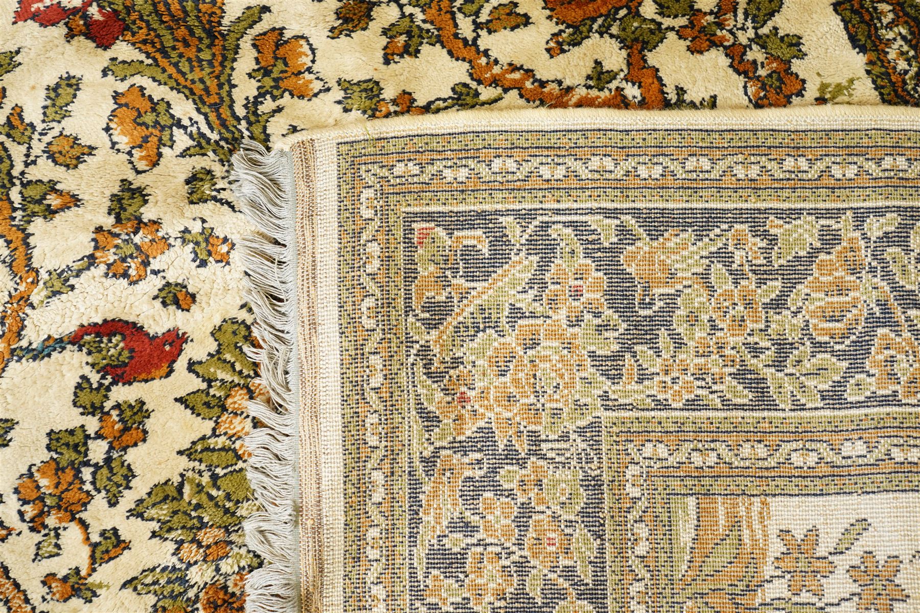 Kashan style rug, twin peacocks flanking a large decorative urn, motifs tree of life style, multiple borders with fine floral patterns 