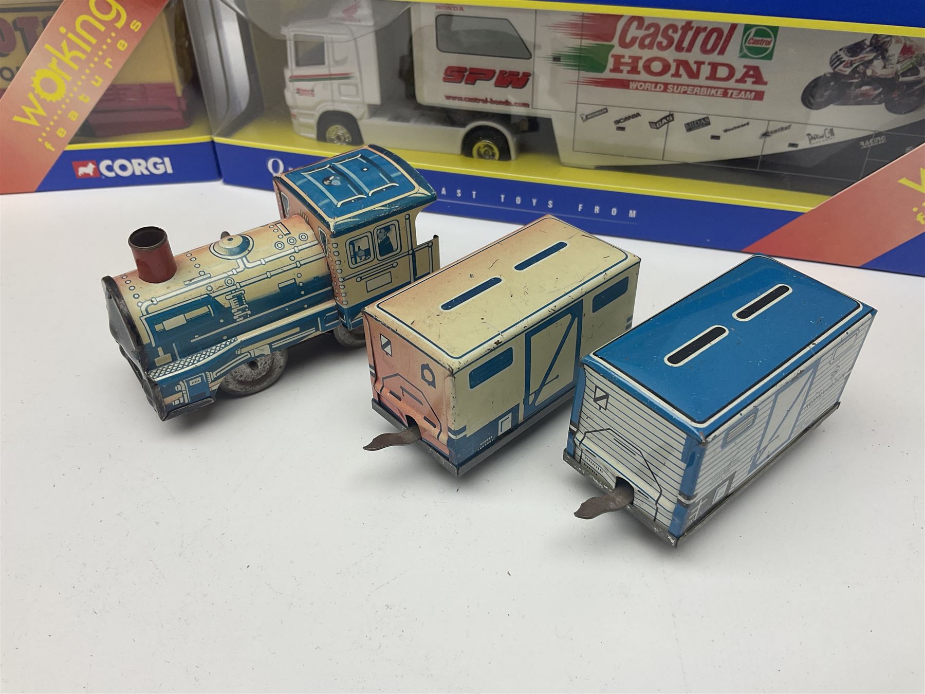 Crescent Saladin Armoured Patrol Set; boxed; unboxed Dinky Leopard Tank and American 105mm gun; two Corgi Superhaulers - TY86601 Scania Race Transporter Castrol Honda and TY86617 Scania Cutrainside Prestons of Potto; both boxed; and post-WW2 German clockwork tin-plate three-piece train set