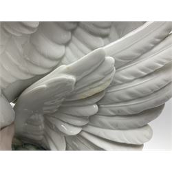 Large Lladro figure group, Swans Take Flight, modelled as two swans upon raised on circular wooden plinth, sculpted by Salvador Debon, H68cm