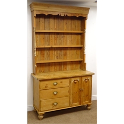  Solid pine kitchen dresser, three shelf back, two cupboard doors, three graduating drawers, turned supports, W122cm, H215cm, D48cm  