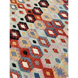 Large Kilim carpet, overall geometric design, decorated with lozenges within a tailing border, geometric guard stripes 