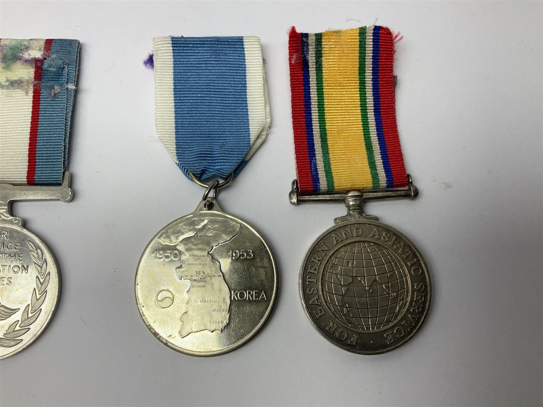 1949 Yangtze Incident HMS Consort casualty Naval General Service Medal with two clasps for Yangtze 1949 and Malaya awarded to D/SSX. 788562 J. Tootell A.B.R.N.; with four other medals comprising Republic of Korea War Service Medal, Eastern Service Medal, unofficial British and Commonwealth Occupation Forces Association Occupation of Japan medal and IFKVWA 40th Anniversary Medal; together with an archive of contemporary and later related items including Certificate of Service 1946-54, Recommendations for Advancement and Conduct Record Sheet 1946-53, Quartermasters History Sheet 1949-53, Destroyer Association China Station 1945-53 beret, later manuscript journal with his own account of the Yangtze incident etc, Joe's birth certificate details dated 1968, reprinted half-length portrait in uniform, Manual of Seamanship 1937, modern shield and framed crests, blazer badges and metal badges and a copy of Loyal & Steadfast - The Story of HMS Consort 2008, which gives details of how Joe Tootell received his wounds, the extract reads ' When Consort came under fire a short time later it was a strange, perhaps unreal experience for many of the crew who had never seen action before. Ordinary Seaman Joe Tootell was in the wheelhouse. 'I could not see the action. We could hear the ship taking severe punishment. When the wheelhouse took a direct hit, killing the coxwain, Chief Petty Officer Gurney, and myself receiving multiple shrapnel wounds, the steering mechanism was put out of action.'