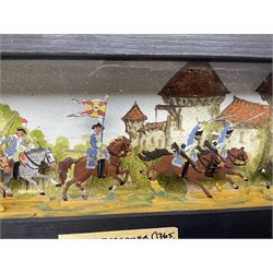 Seven case flat figures, Prussian Dragoons, with hand painted back drop, paper label to the front marked 'German Dragoner C1765', H10cm, L29cm 