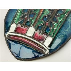 Henry George Murphy (1884-1939), Arts & Crafts enamel panel, of bulbous elliptical form decorated with a stylised crown in green, red and white, upon a turquoise toned ground, H12cm W9cm