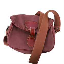 Leather cartridge bag with a canvas strap, together with another cartridge bag, two leather belts etc
