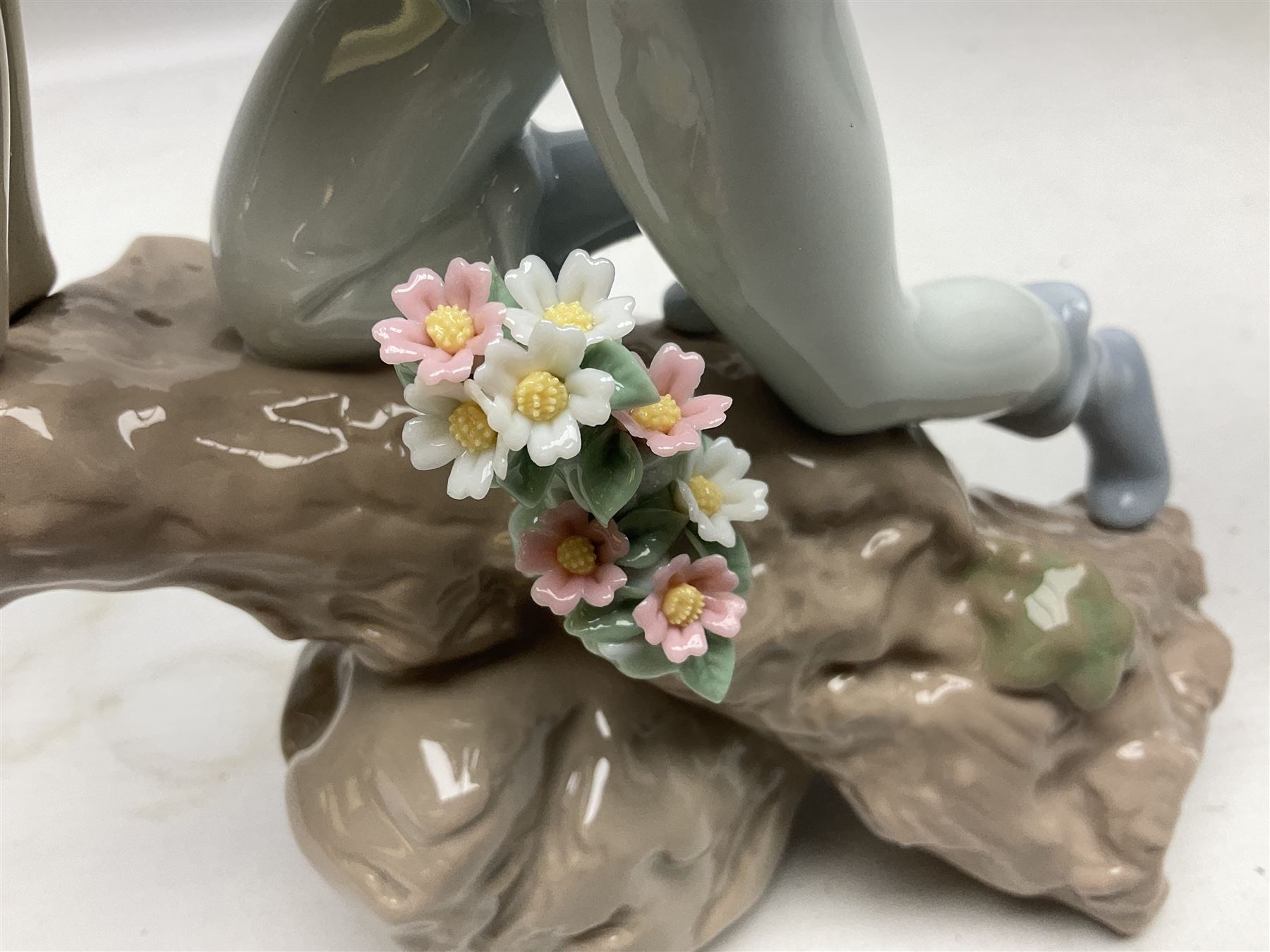 Lladro Privilege figure, Prince of Elves, modelled as an elf with wings leaning upon a rock, with original box, no 7690, sculpted by Joan Coderch, year issue 2001, year retired 2003, H23cm