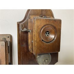 Two Hunningscone patent wall mounting telephones in walnut casing, together with Sterling Telephone & Electric Co. Ltd early wall-mounted telephone 'Primax' and one other 