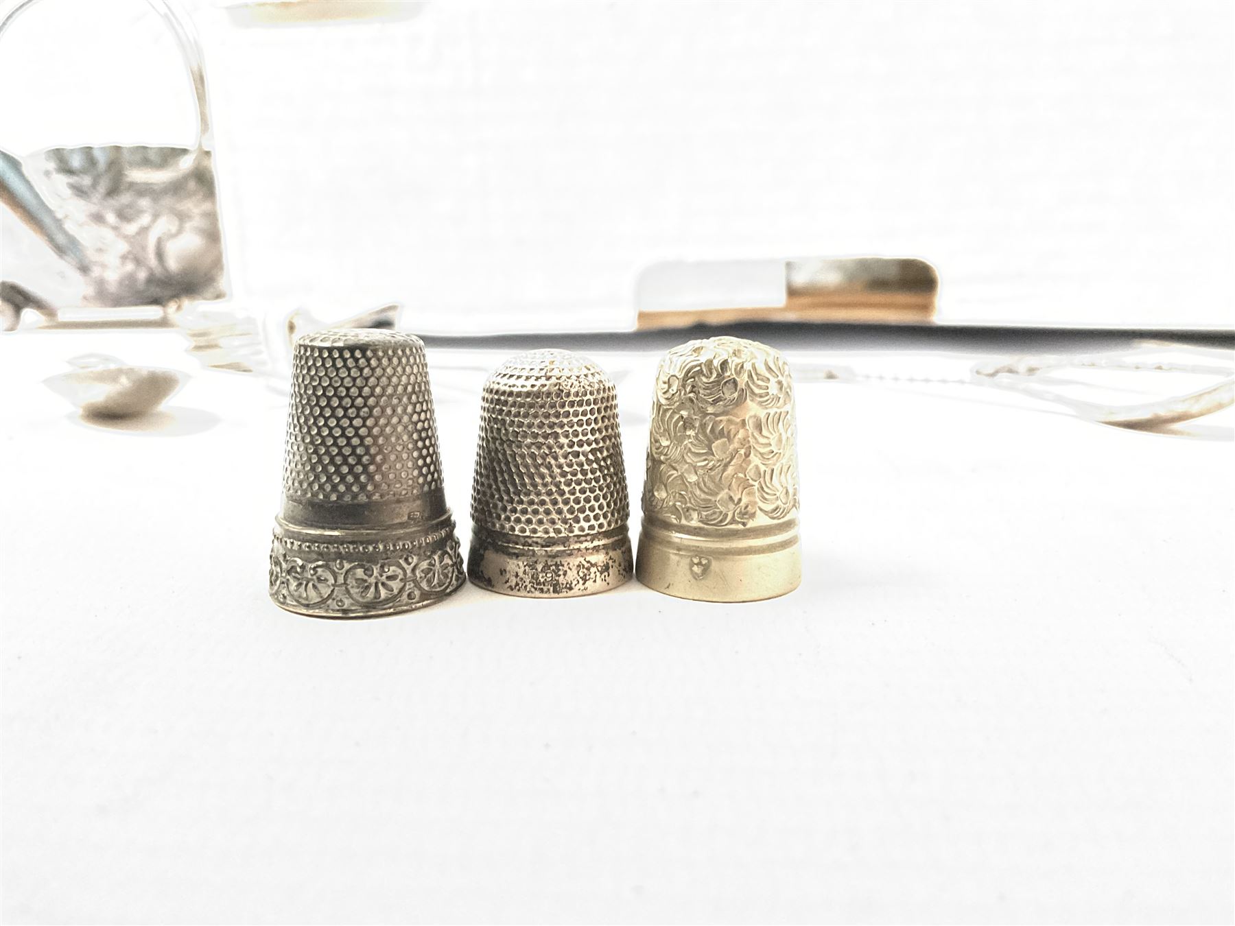 Quantity of silver thimbles and teaspoons, various hallmarks and stamps, and a quantity of other silver plate and metalware