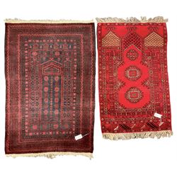  Persian indigo ground pray rug, decorated with geometric bands and stylised flower heads (137cm x 90cm); and a small red ground prayer rug (117cm x 77cm)