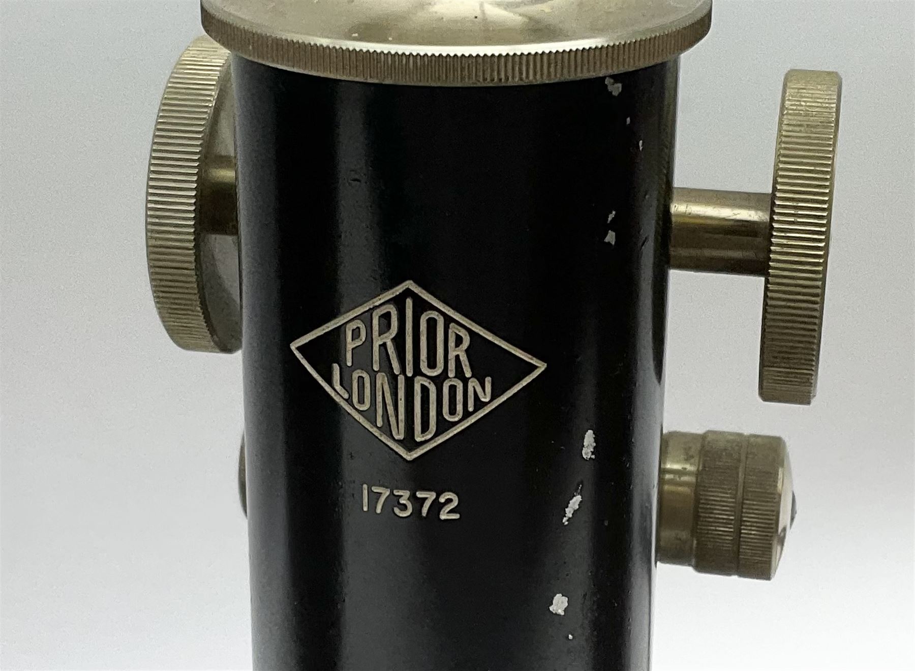 Black finished monocular microscope by Prior London No. 17372,  with pitchfork base and rack and pinion focusing, in original fitted wooden case with additional lenses, H32cm, together with Watts dumpy level, no. 116249, in a leather case