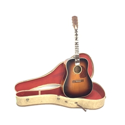 Levin LM 26 acoustic guitar, with carrying case. Provenance: This Guitar was on the INXS Dirty Honeymoon Tour 1994 
